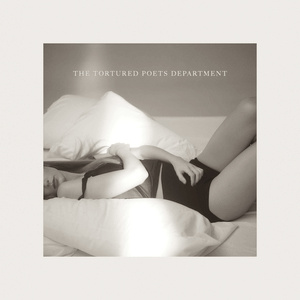 Taylor Swift The Tortured Poets Department album cover in sepia tones, lying on bed with closed eyes