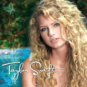 Taylor Swift from her Fearless era, with iconic long curly blonde hair and blue eyes, against a whimsical floral background